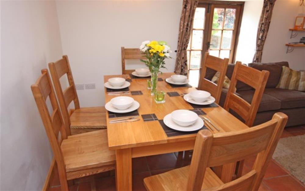 Dining area - patio door leads to the garden at Apple Tree Cottage, Awliscombe in Honiton
