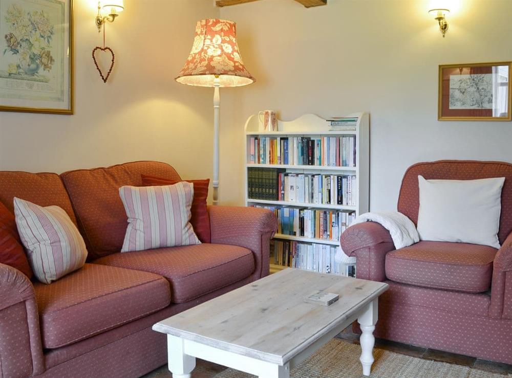 Comfortable seating area within living room at Apple Tree Cottage in Dereham, Norfolk