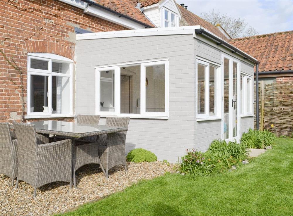 Gravelled patio area with outdoor furniture at Apple Tree Cottage in Dereham, Norfolk