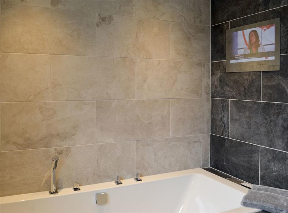 Bathroom with wall mounted TV at Apple Tree House in Dalry, Ayrshire