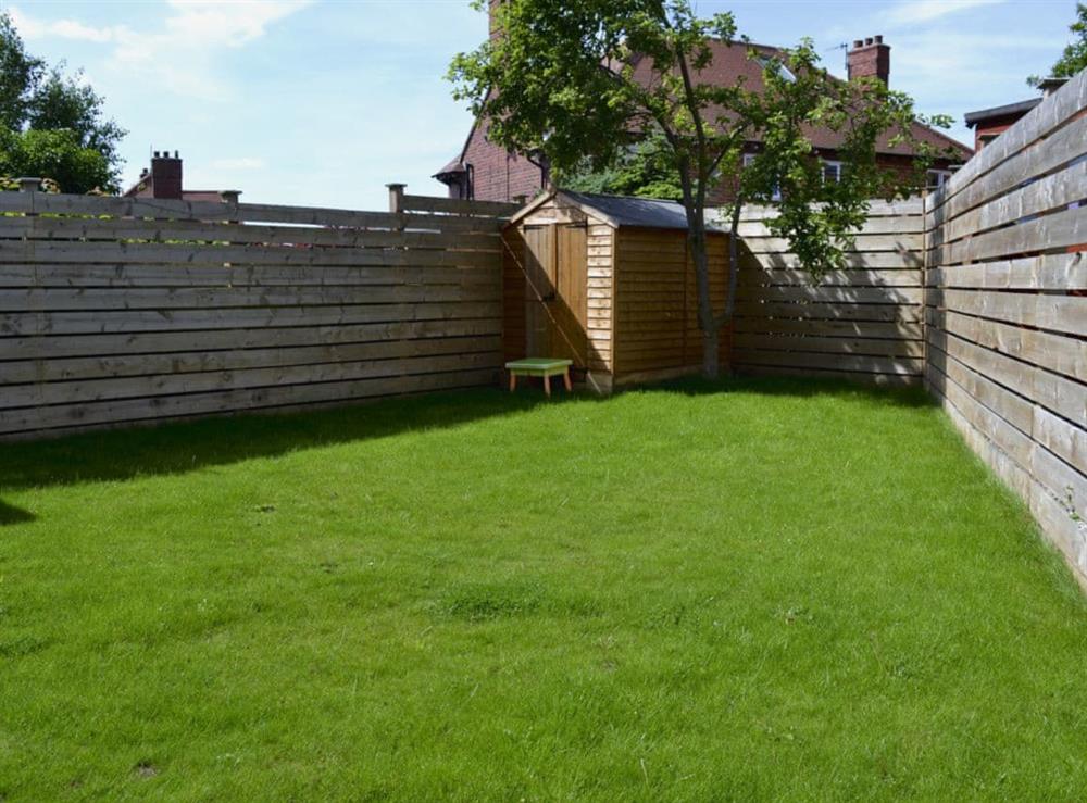 Enclosed lawned garden with patio and garden furniture (photo 3) at Apple Tree House in Scarborough, North Yorkshire