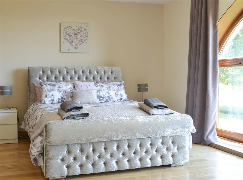 fabulous master bedroom with kingsize bed, cot, large picture window, dressing room and large en-suite bathroom (photo 2) at Applegarth House in Howlish, near Bishop Auckland, Durham