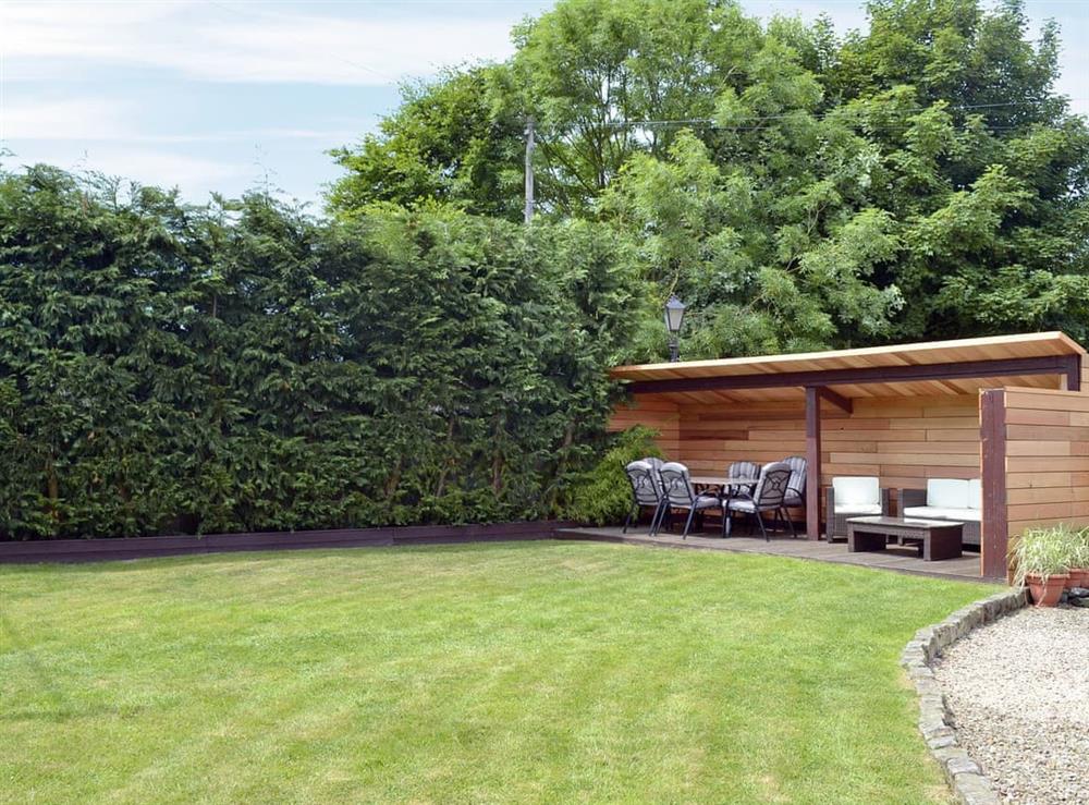 Impressive enclosed lawned garden with sitting-out area at Applegarth House in Howlish, near Bishop Auckland, Durham