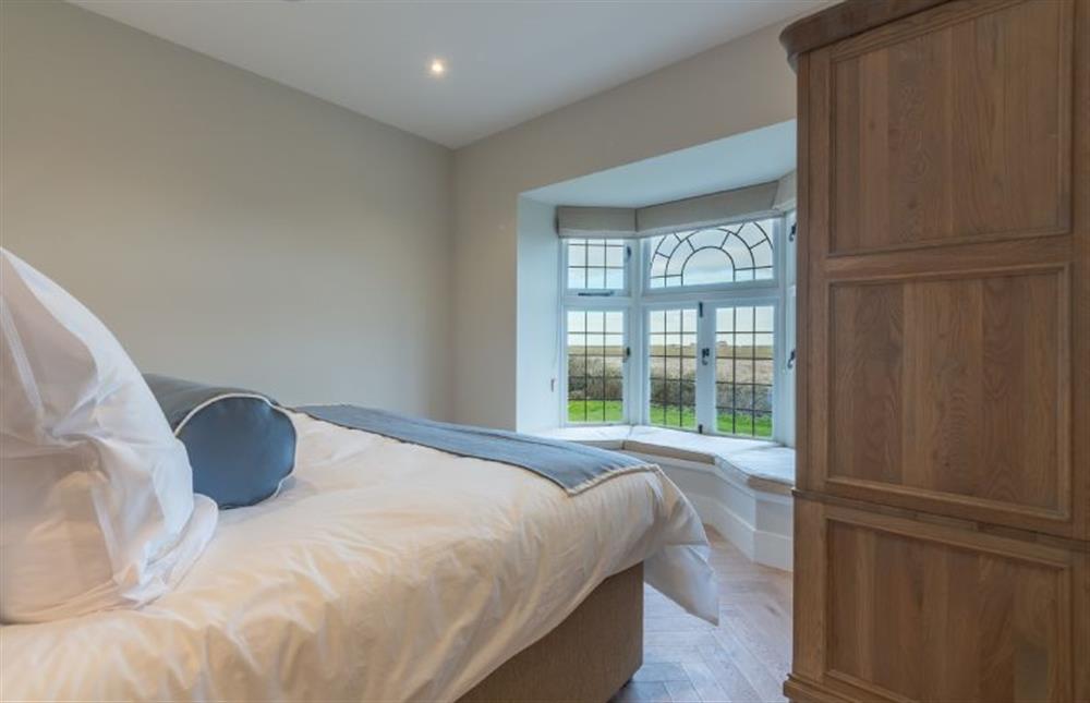 First floor: The master bedroom has super-king size bed at Appletree Barn, Brancaster near Kings Lynn