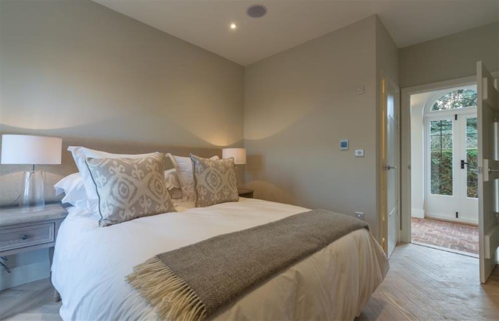 Ground floor: Bedroom two has an en-suite shower room at Appletree Barn, Brancaster near Kings Lynn