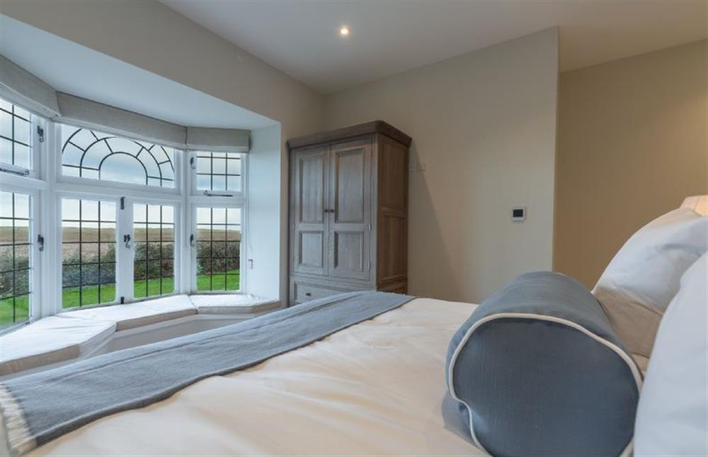 Ground floor: Elegant bay window in the master bedroom at Appletree Barn, Brancaster near Kings Lynn