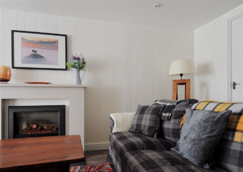 Relax in the living area at Appletree Cottage, Lyme Regis