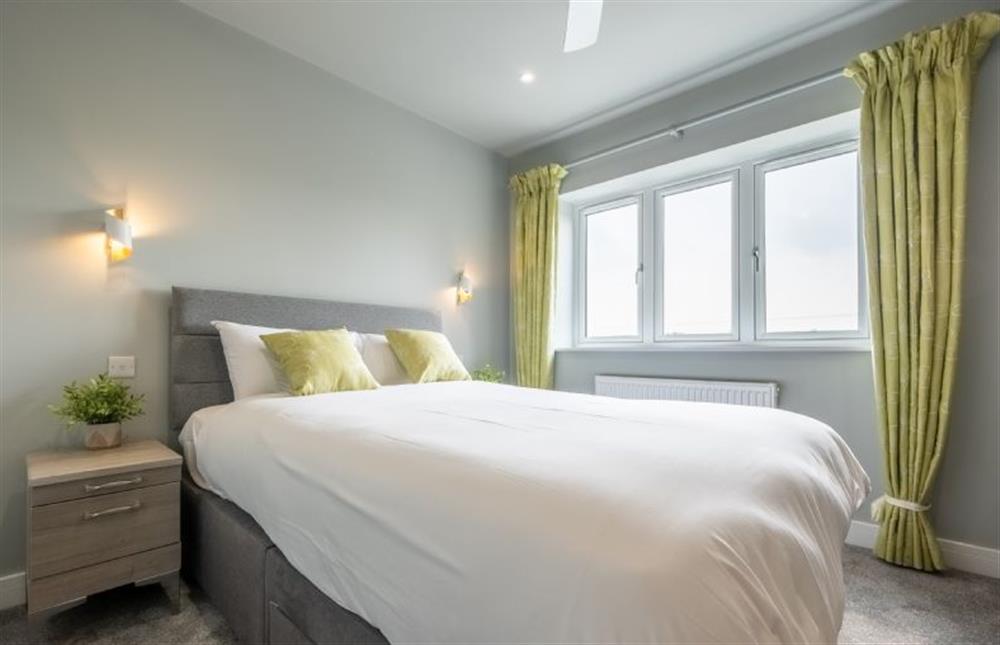 Bedroom three with 5’ king-size bed at Appletrees, Burnham Market near Kings Lynn