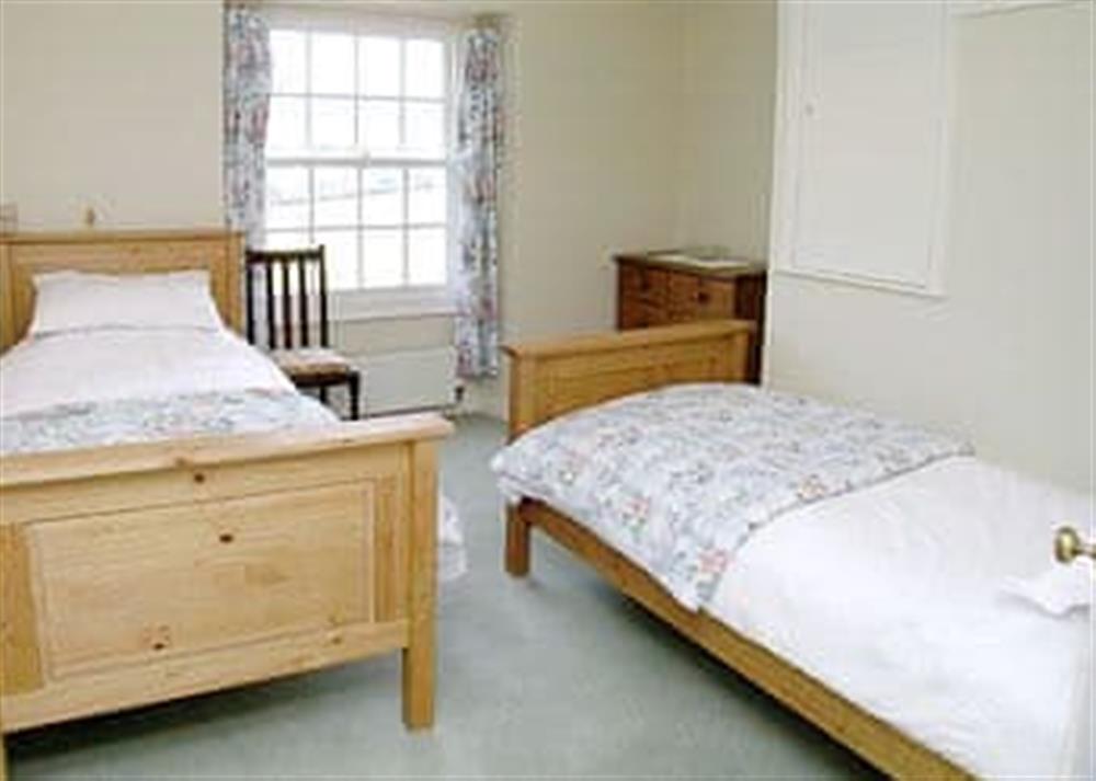 Twin bedroom at Applewood Cottage in Walditch, near Bridport, Dorset