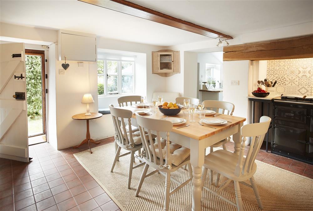 Kitchen with Rayburn range and dining table seating six at Appleyard Cottage, Donhead St Mary