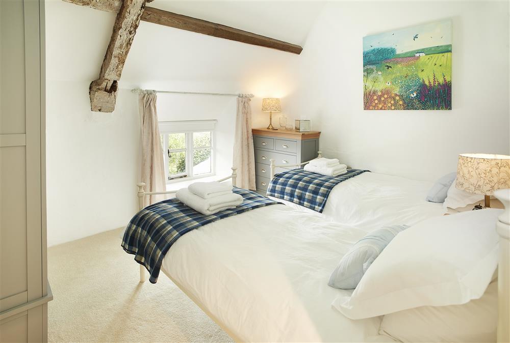 Second bedroom with twin 3’ single beds and vaulted ceilings at Appleyard Cottage, Donhead St Mary