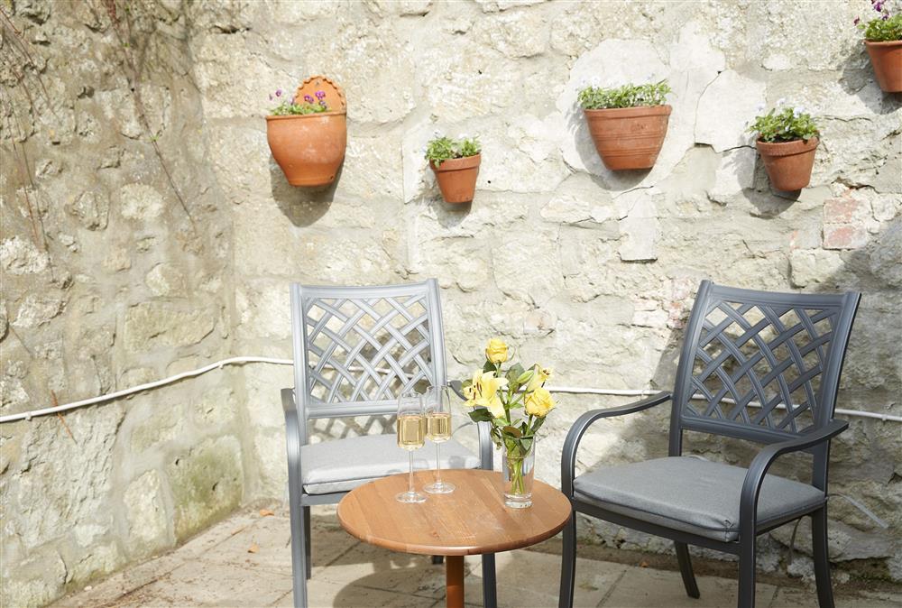 To the rear of the cottage is an enclosed courtyard garden, perfect for soaking up the sun or for visiting pets