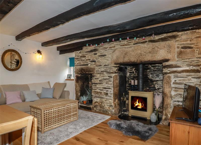 Relax in the living area at April Cottage, Camelford