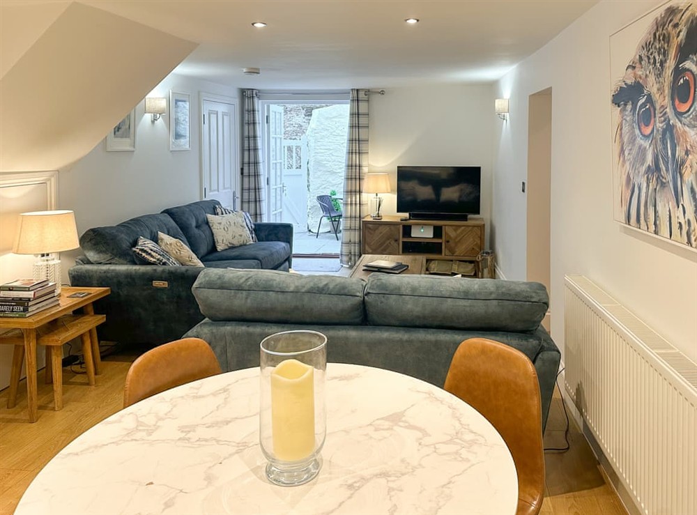 Living room/dining room at April Cottage in Dartmouth, Devon