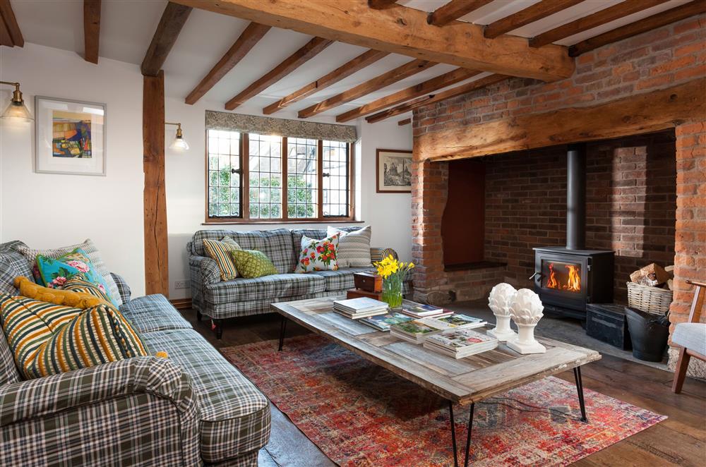 Cosy up in the sitting room in front of the wood burning stove at April Cottage, Eckington