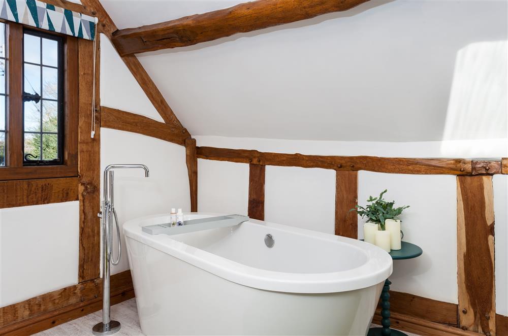 Exposed beams can be enjoyed throughout the property