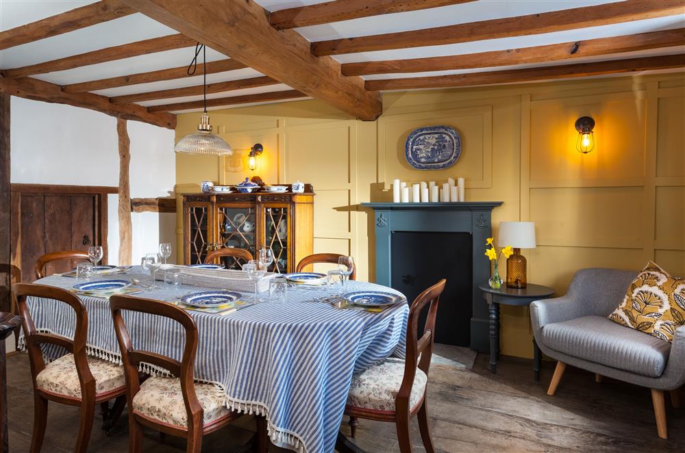 The dining room with decorative fire place at April Cottage, Eckington