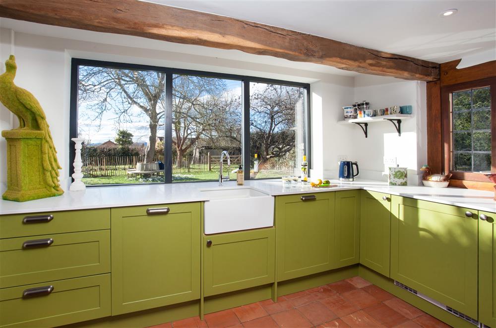 The kitchen looks out to the garden with beautiful views at April Cottage, Eckington