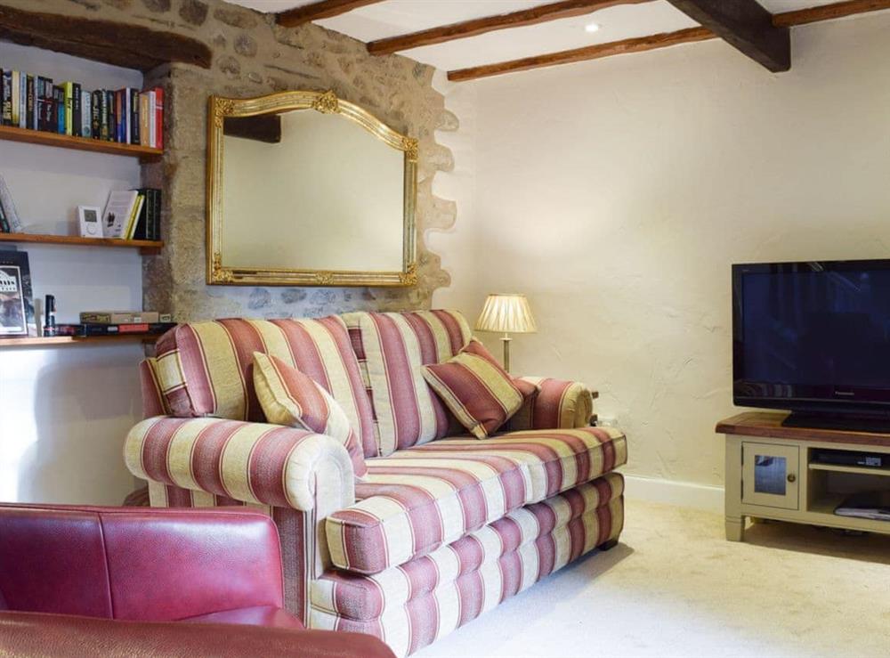 Comfortable beamed living room at April Cottage in Settle, North Yorkshire