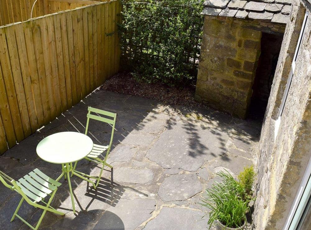 Enclosed patio with garden furniture (photo 2) at April Cottage in Settle, North Yorkshire