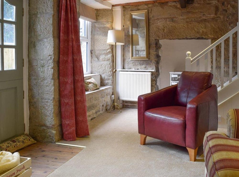Stylish furniture and furnishings in the living room at April Cottage in Settle, North Yorkshire