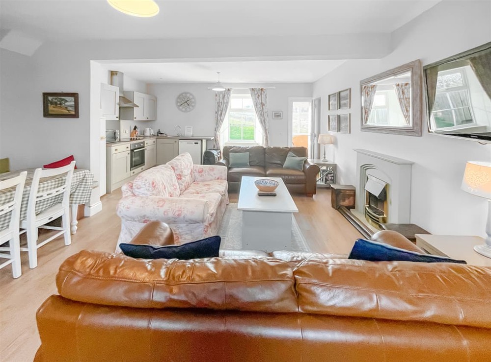 Open plan living space at Arthurs Cottage, 