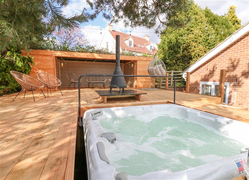 Enjoy the hot tub at Arbour House Farm Bungalow, Durham