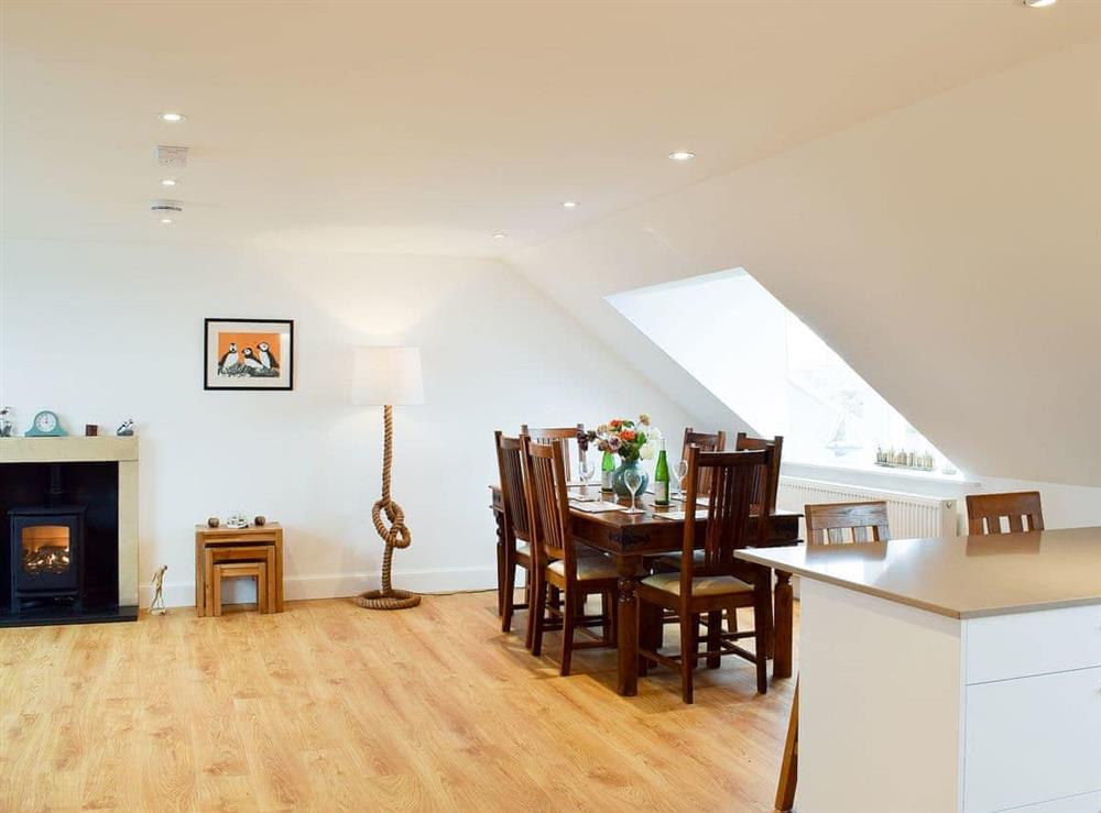 Dining area beneath a Velux roof light at Arc House in Cellardyke, near Anstruther, Fife
