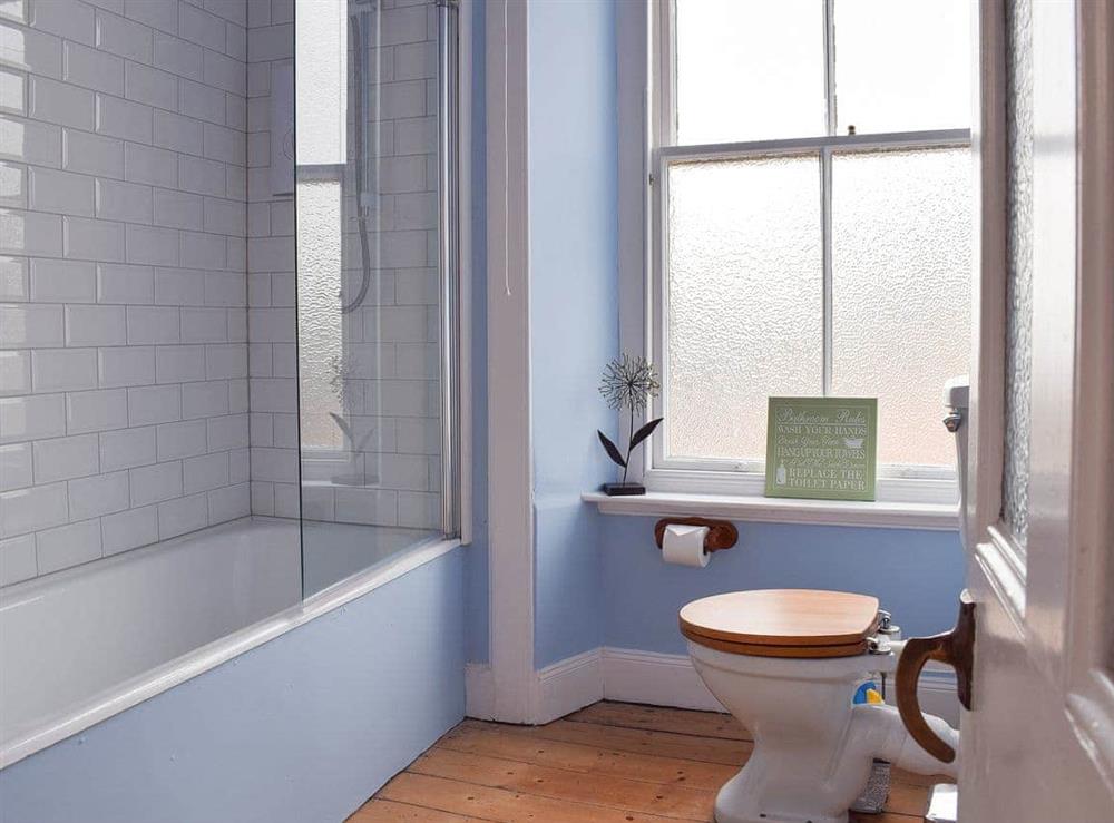 Stylish bathroom with shower over the bath at Arc House in Cellardyke, near Anstruther, Fife