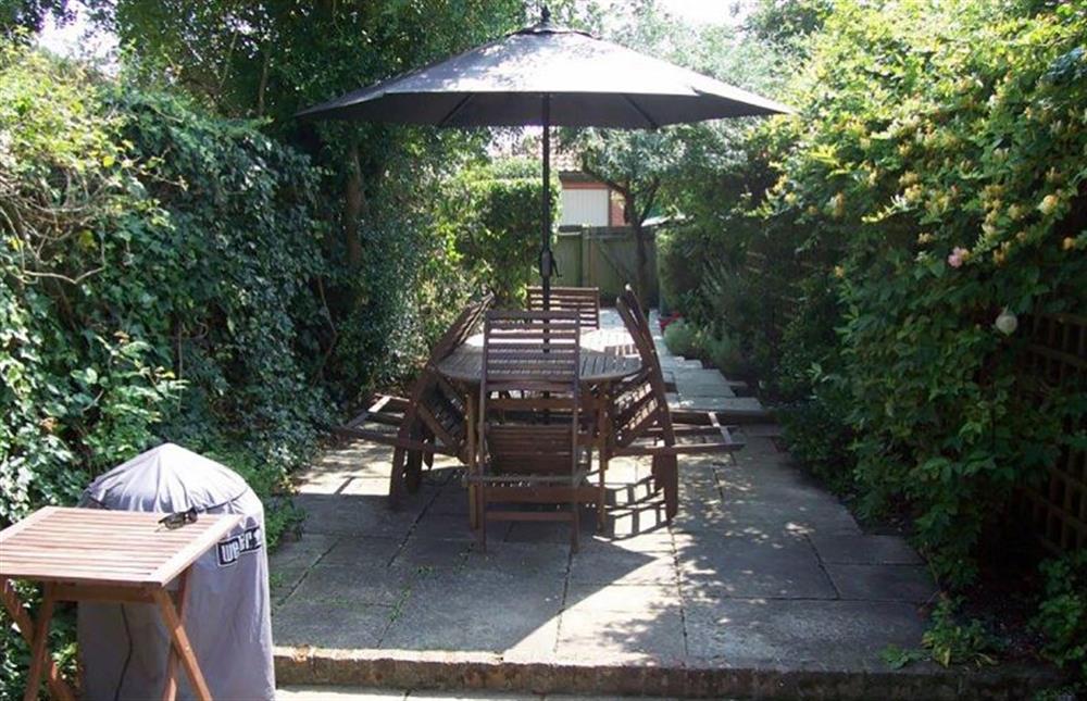 Dining area within the courtyard garden at Arch Cottage, Burnham Market  near Kings Lynn