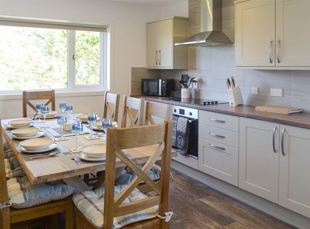 Well-equipped fitted kitchen with convenient dining area at Ardbeg in Westfield, near Thurso, Highlands, Caithness