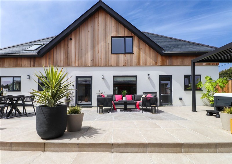 Enjoy a glass of wine on the patio (photo 2) at Ardwyn, Rhosneigr