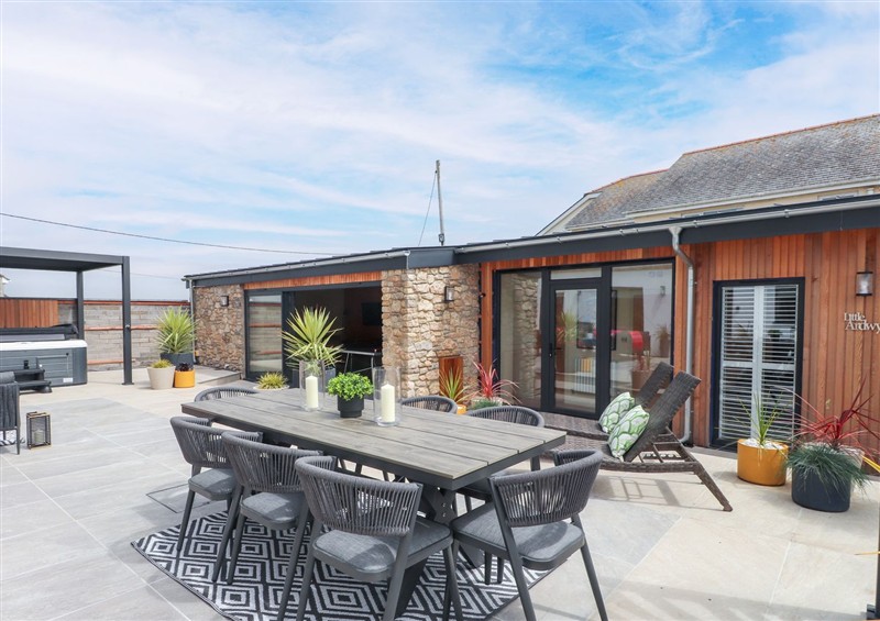 Enjoy a glass of wine on the patio at Ardwyn, Rhosneigr