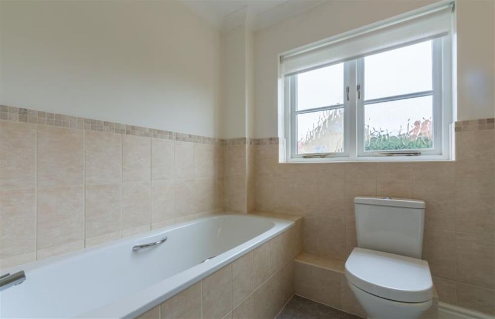 First floor: Bathroom with bath and shower cubicle at Arisaig, Wells-next-the-Sea