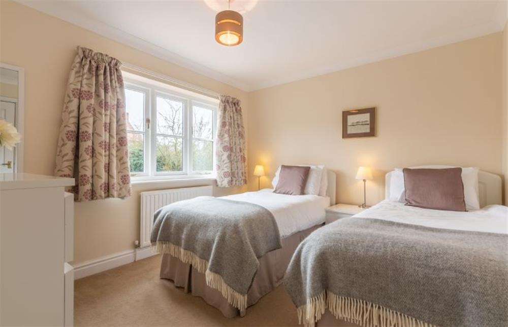 First floor: Bedroom two with full-size single beds at Arisaig, Wells-next-the-Sea