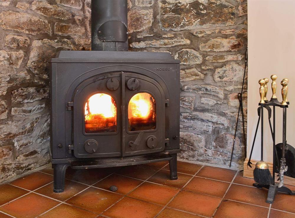 A traditional woodburning stove provides extra charm, as well as warmth