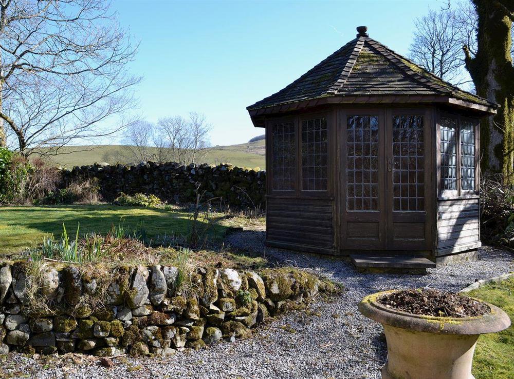 The garden has a summerhouse at Arkland Mill in Crocketford, near Dumfries., Kirkcudbrightshire