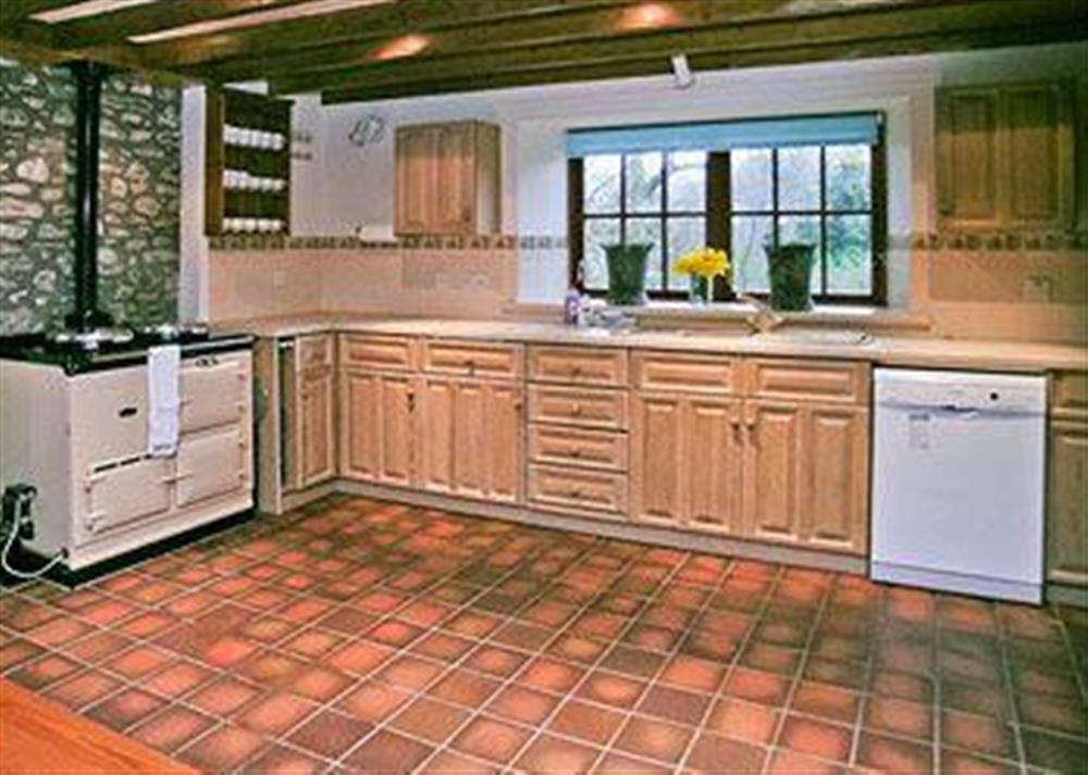 The tiled kitchen area is well equipped with an oil-fired Aga for cooking at Arkland Mill in Crocketford, near Dumfries., Kirkcudbrightshire