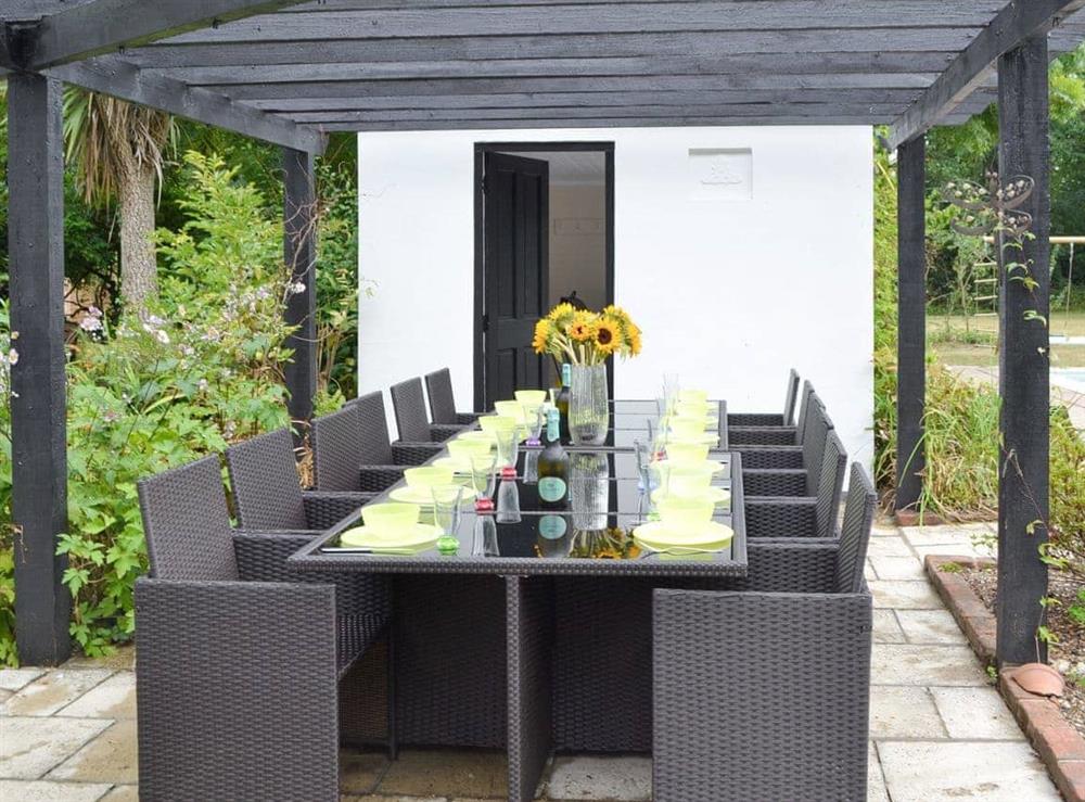 Paved patio area with outdoor dining furniture (photo 2) at Arnewood Corner in Sway, near Lymington, Hampshire