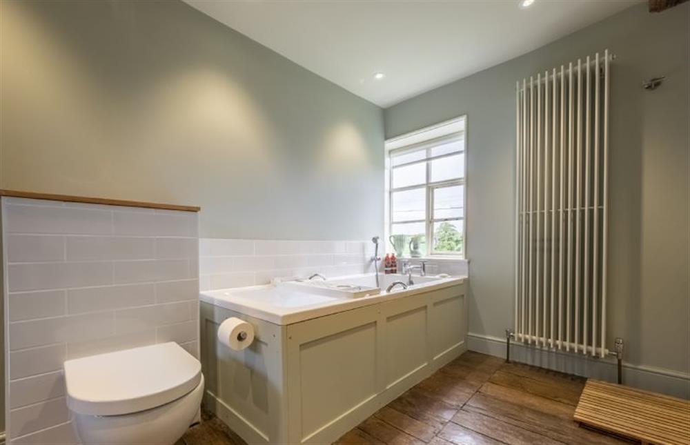 En-suite bath and shower room at Art Farmhouse, Saxmundham