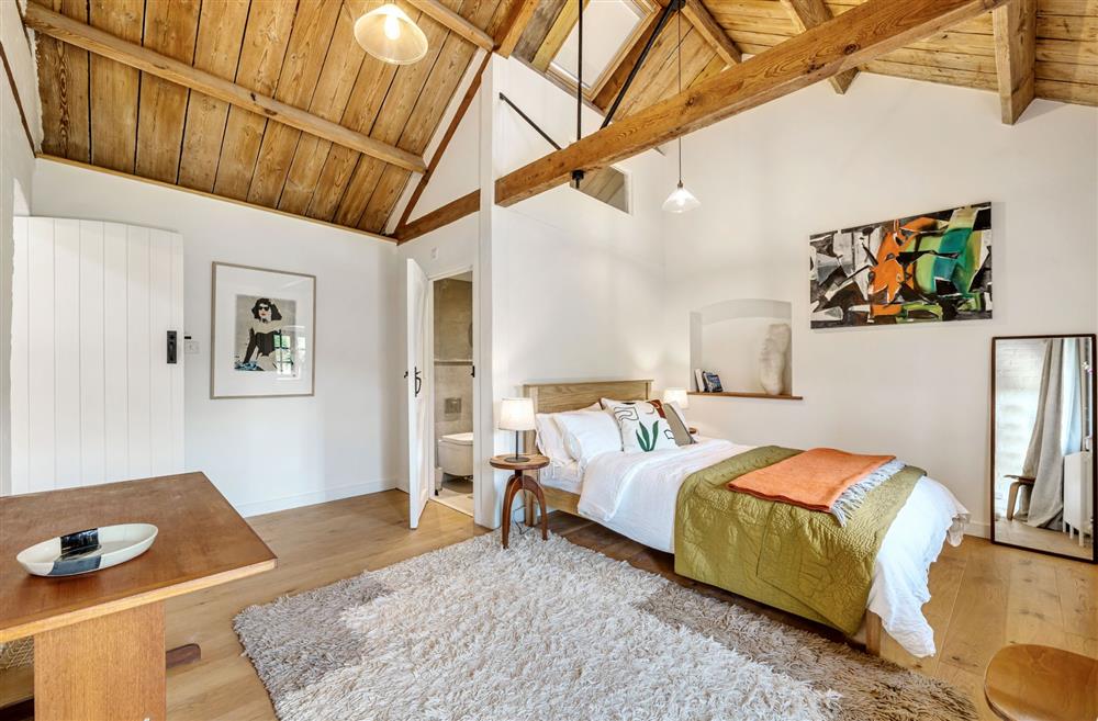 The double height bedroom with original beams at Arthouse, Dorchester