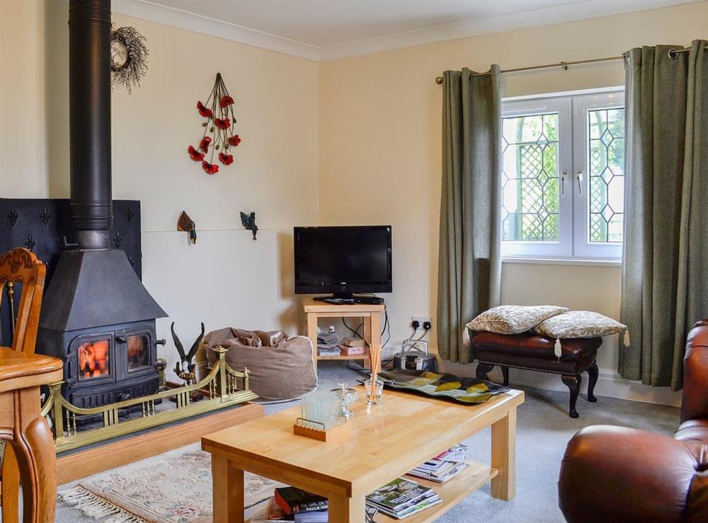 Warm and welcoming living/dining room at Ash Cottage in Llantwit Major, near Cowbridge, Glamorgan, South Glamorgan