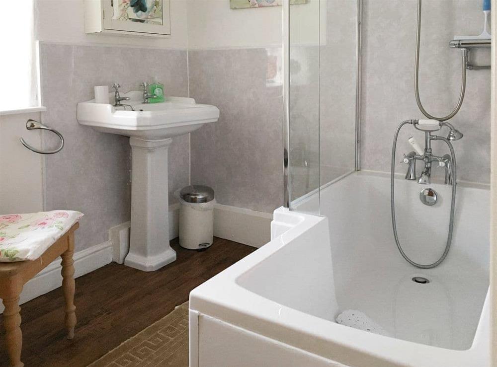 Family bathroom with shower over bath at Ash Cottage in Tideswell, Derbyshire