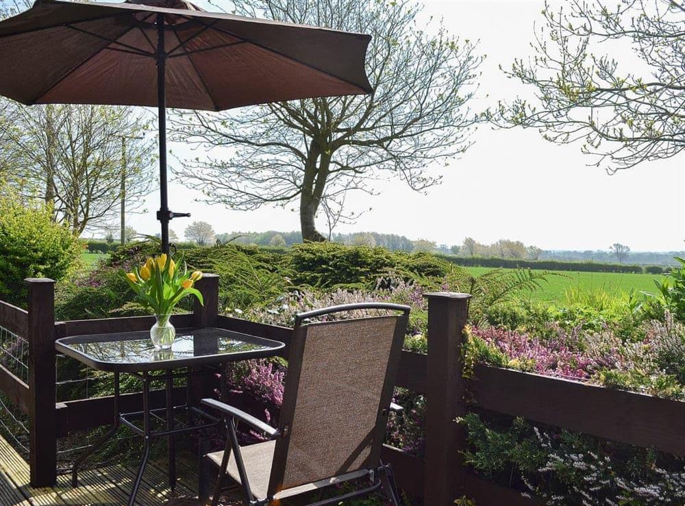 Sit and relax on the decked terrace at Ash Lodge in Nawton, near Helmsley, North Yorkshire