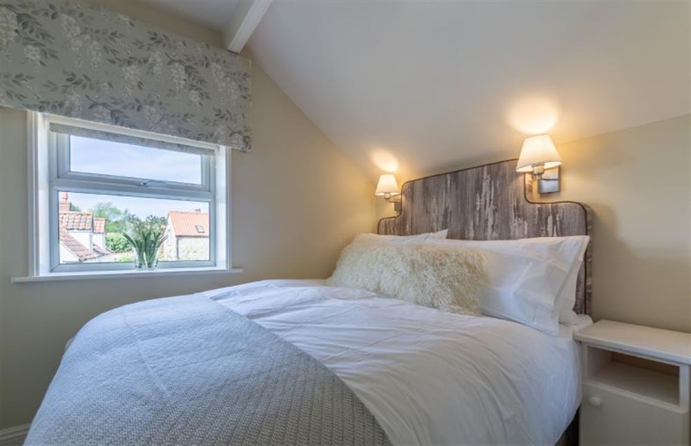 First floor: Bedroom three with double bed at Ashdale, Thornham near Hunstanton