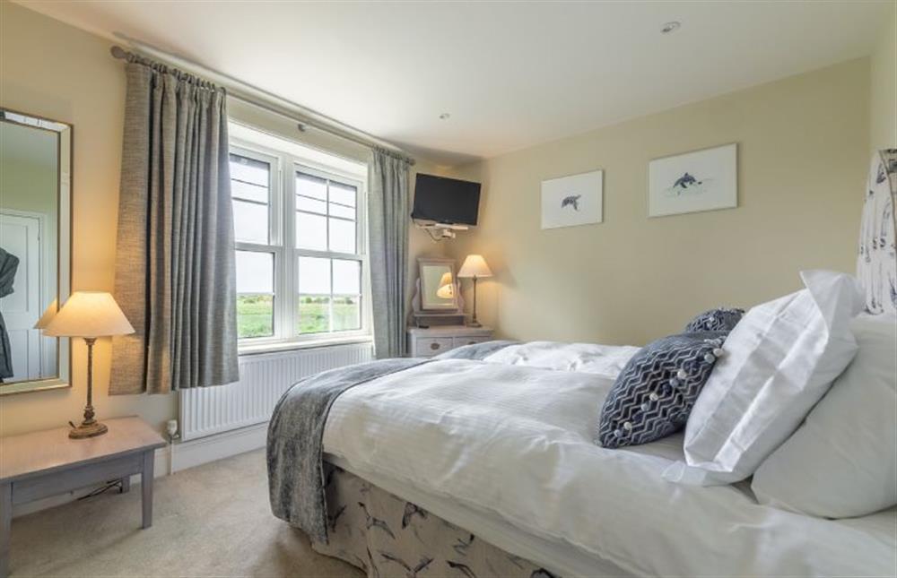 First floor: Bedroom two has distant sea views at Ashdale, Thornham near Hunstanton