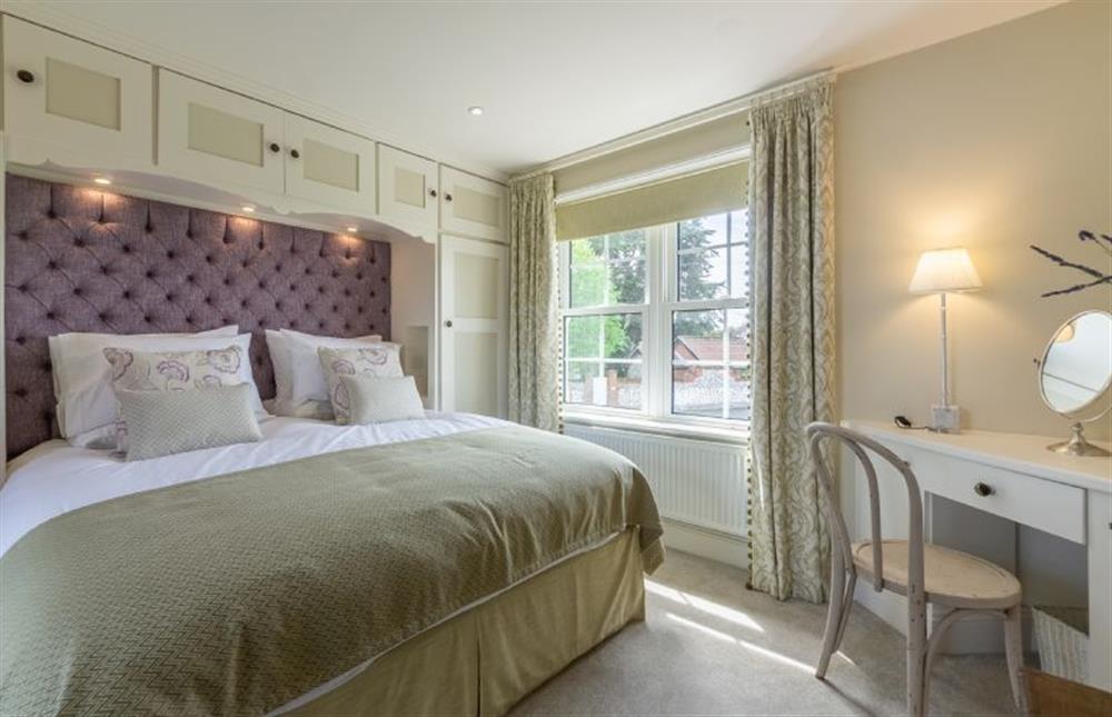 First floor: Master bedroom has king-size bed and distant sea views at Ashdale, Thornham near Hunstanton