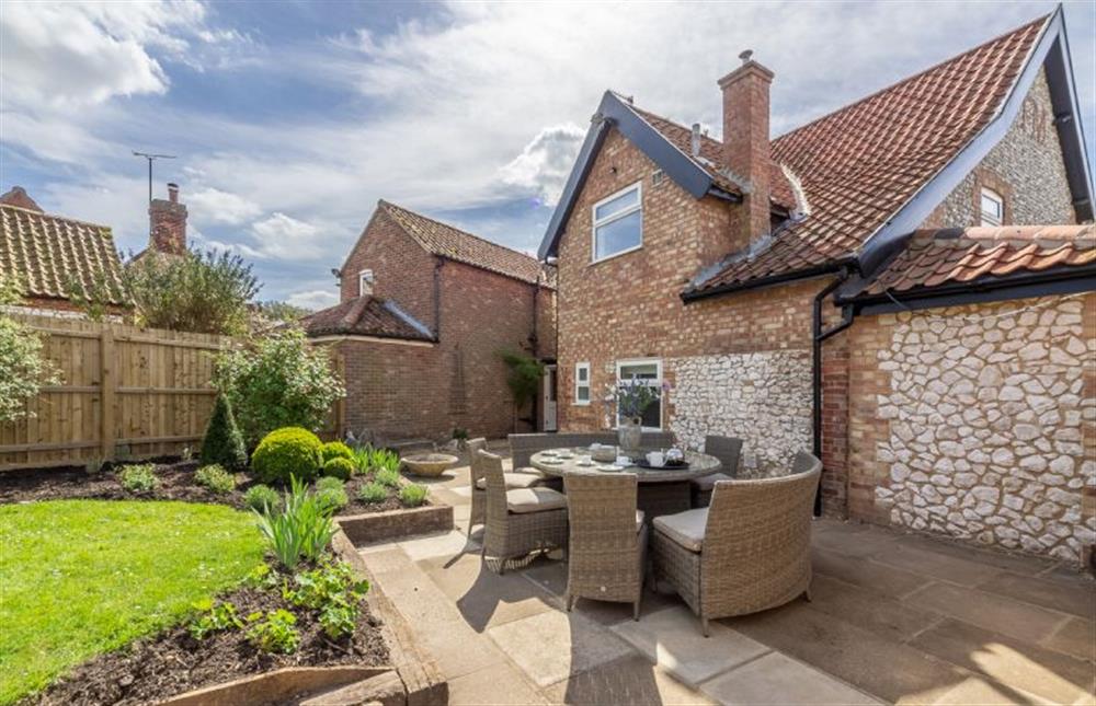The lovely enclosed garden has large patio area  at Ashdale, Thornham near Hunstanton