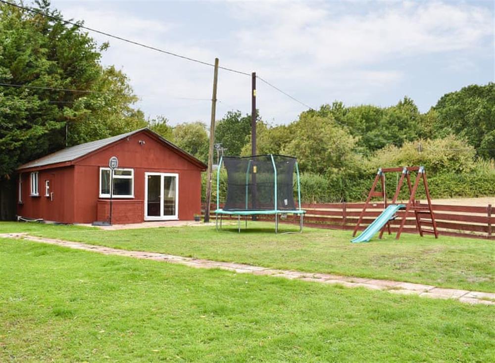 Children’s play equipment and games barn at Ashdene Cottage in South Marston, Wiltshire