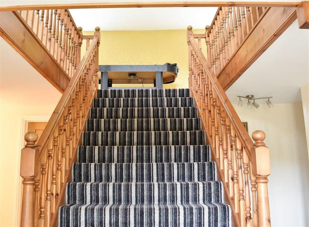 Impressive staircase to the galleried first floor at Ashdene Cottage in South Marston, Wiltshire